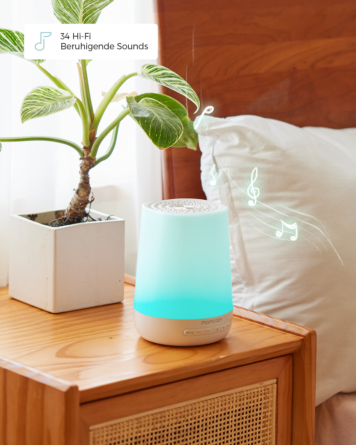 Smart baby sound machine with soothing blue glow and app control on bedside table.