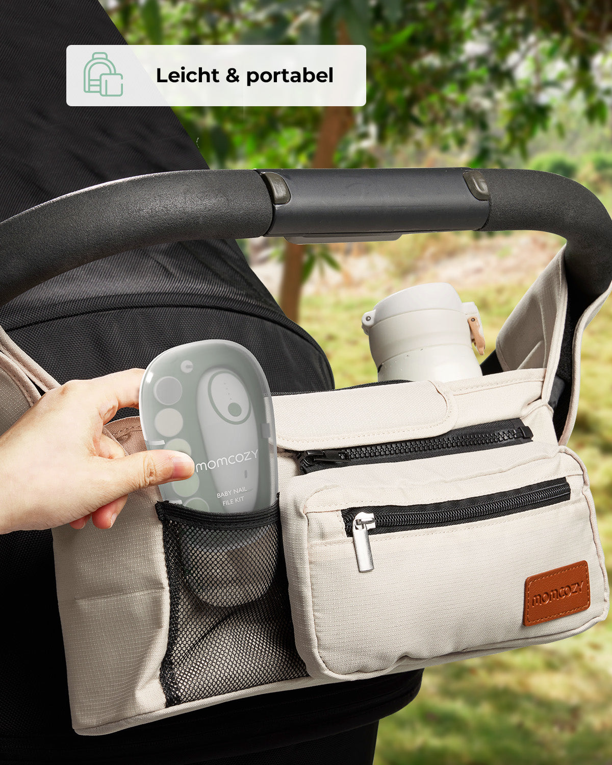 Momcozy nail file placed in a stroller organizer, showcasing portability and convenience.